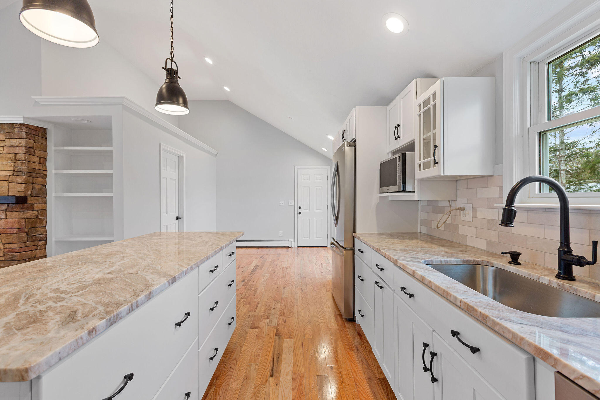 276 Scargo Hill Road South Dennis, MA 02660 - Photo 25 of 53 a spacious kitchen with stainless steel appliances granite countertop a sink dishwasher and white cabinets with wooden floor