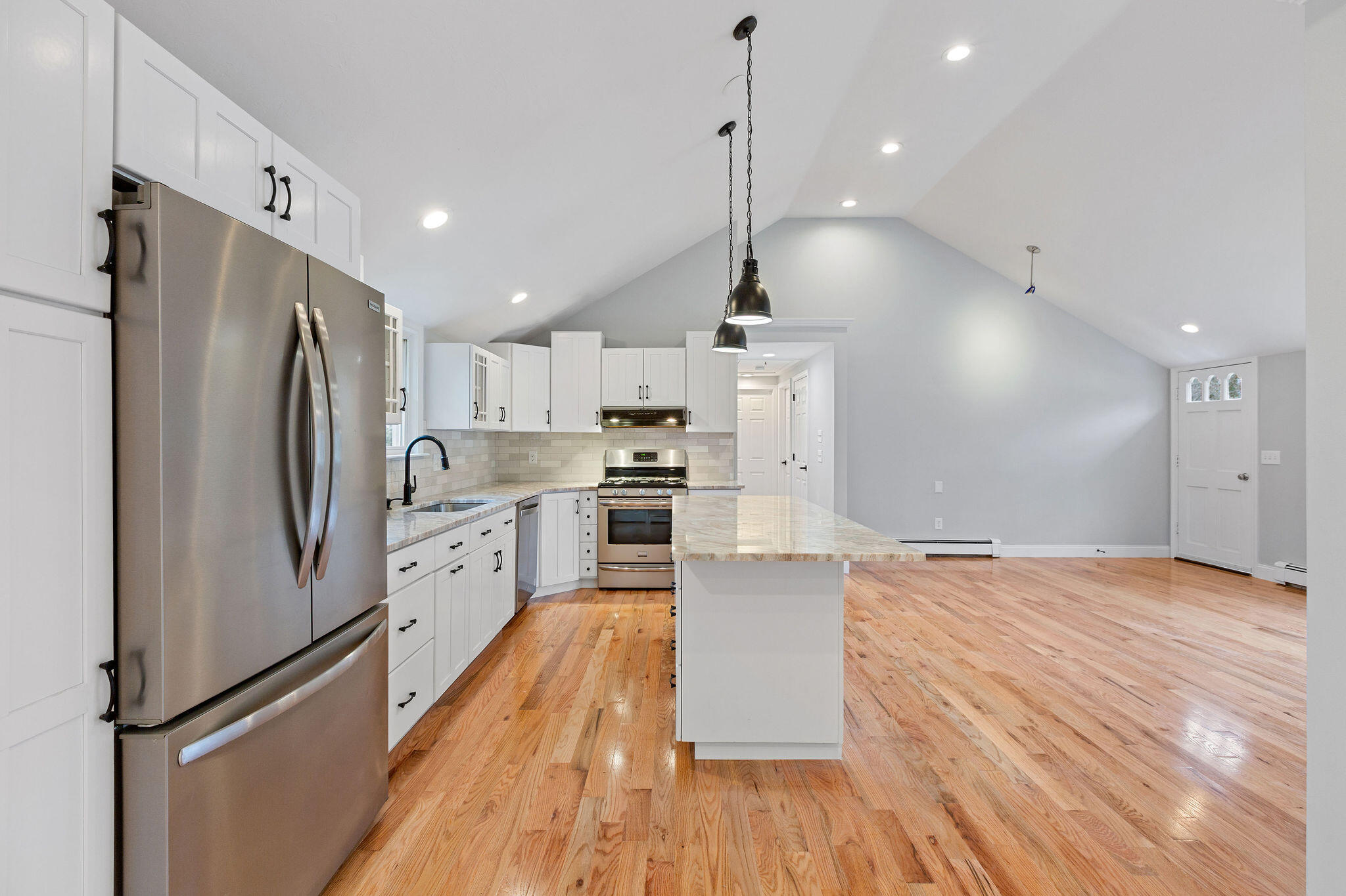 276 Scargo Hill Road South Dennis, MA 02660 - Photo 26 of 53 a large kitchen with stainless steel appliances a refrigerator and a wooden floor