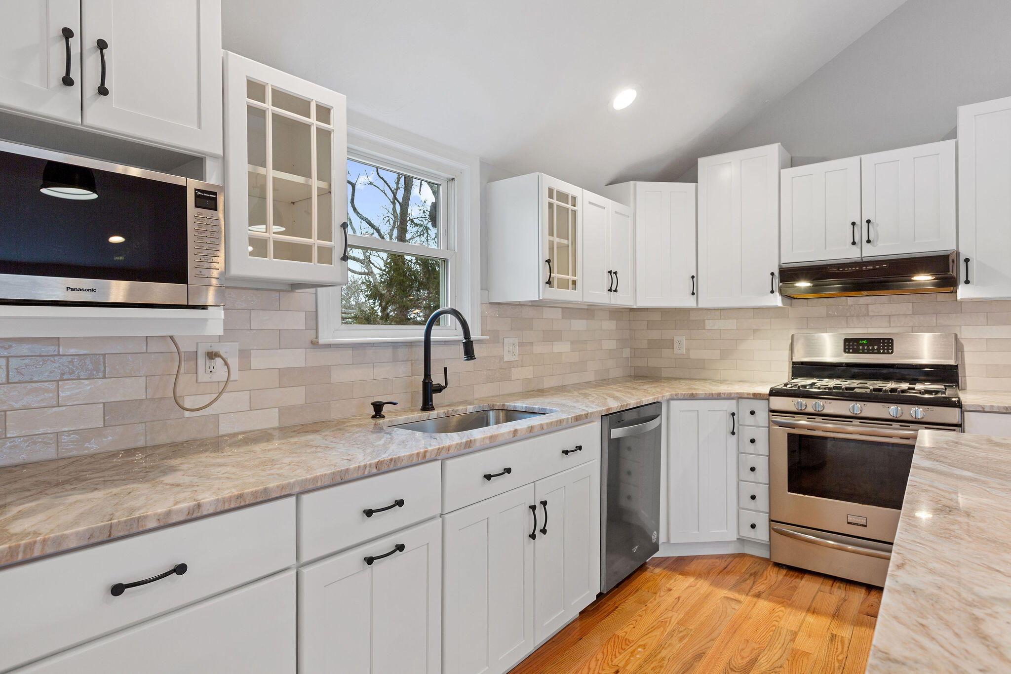 276 Scargo Hill Road South Dennis, MA 02660 - Photo 27 of 53 a kitchen with granite countertop a sink a stove and cabinets