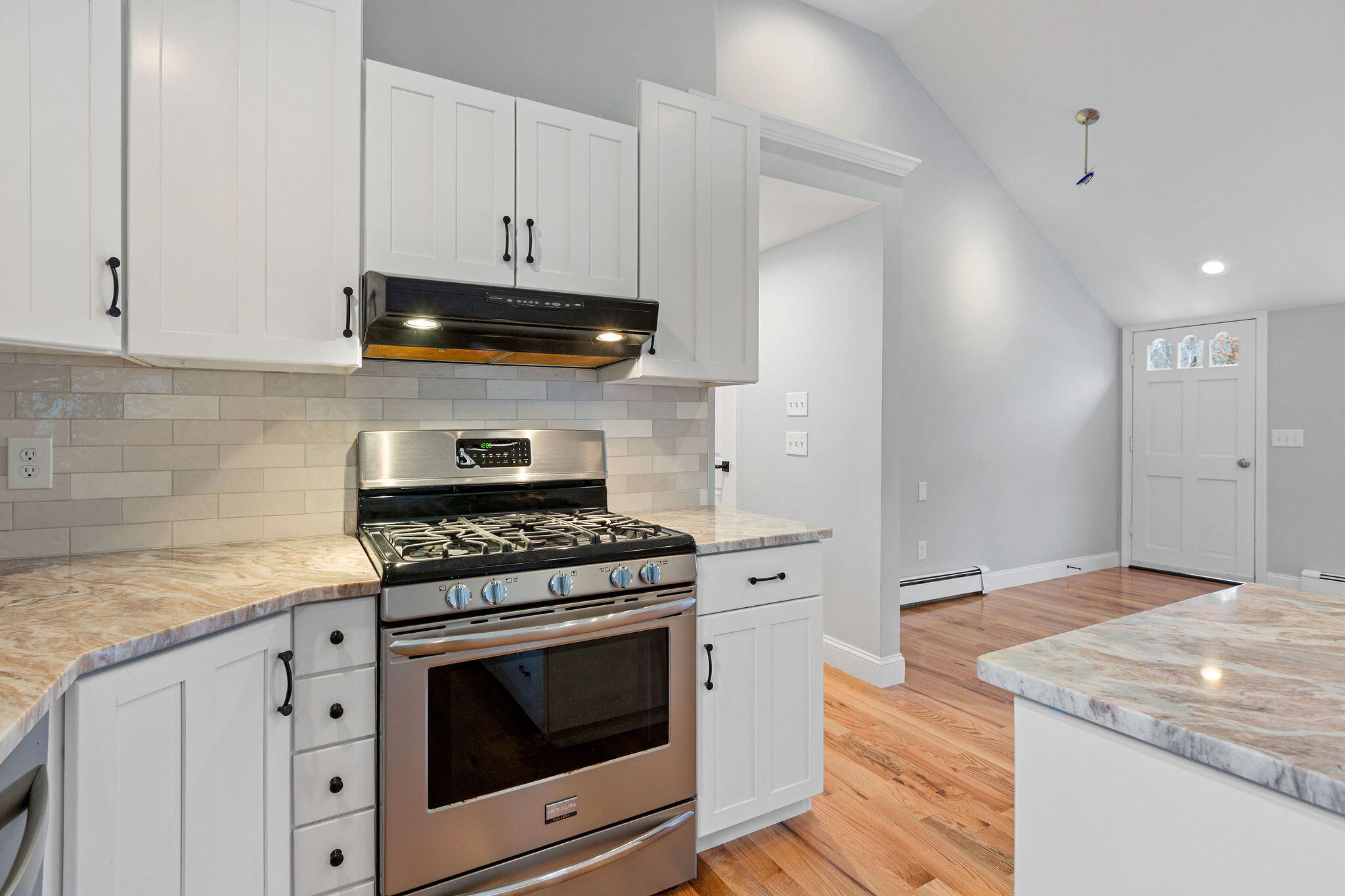 276 Scargo Hill Road South Dennis, MA 02660 - Photo 28 of 53 a kitchen with granite countertop white cabinets and stainless steel appliances