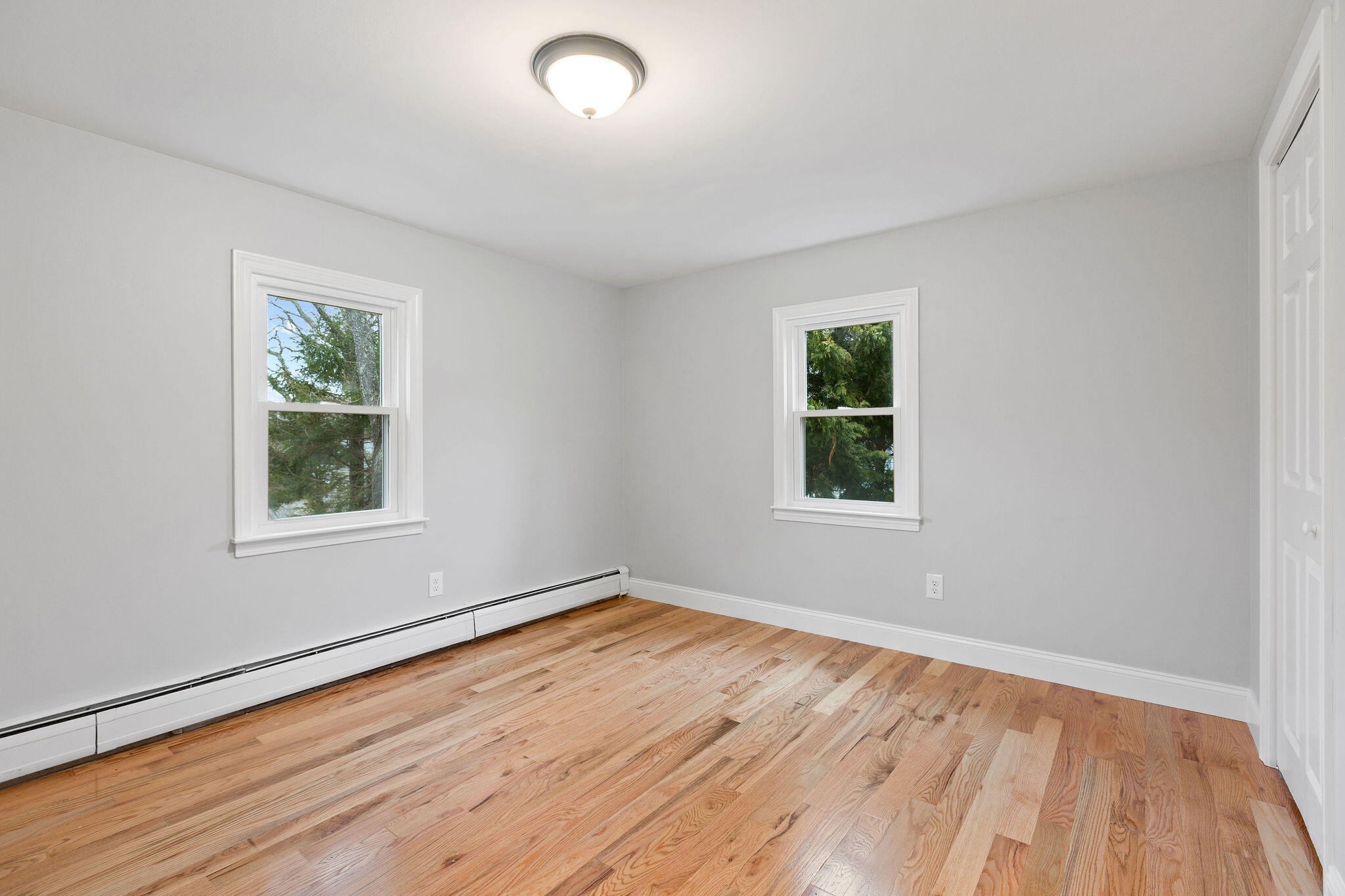 276 Scargo Hill Road South Dennis, MA 02660 - Photo 39 of 53 a view of an empty room with wooden floor and a window