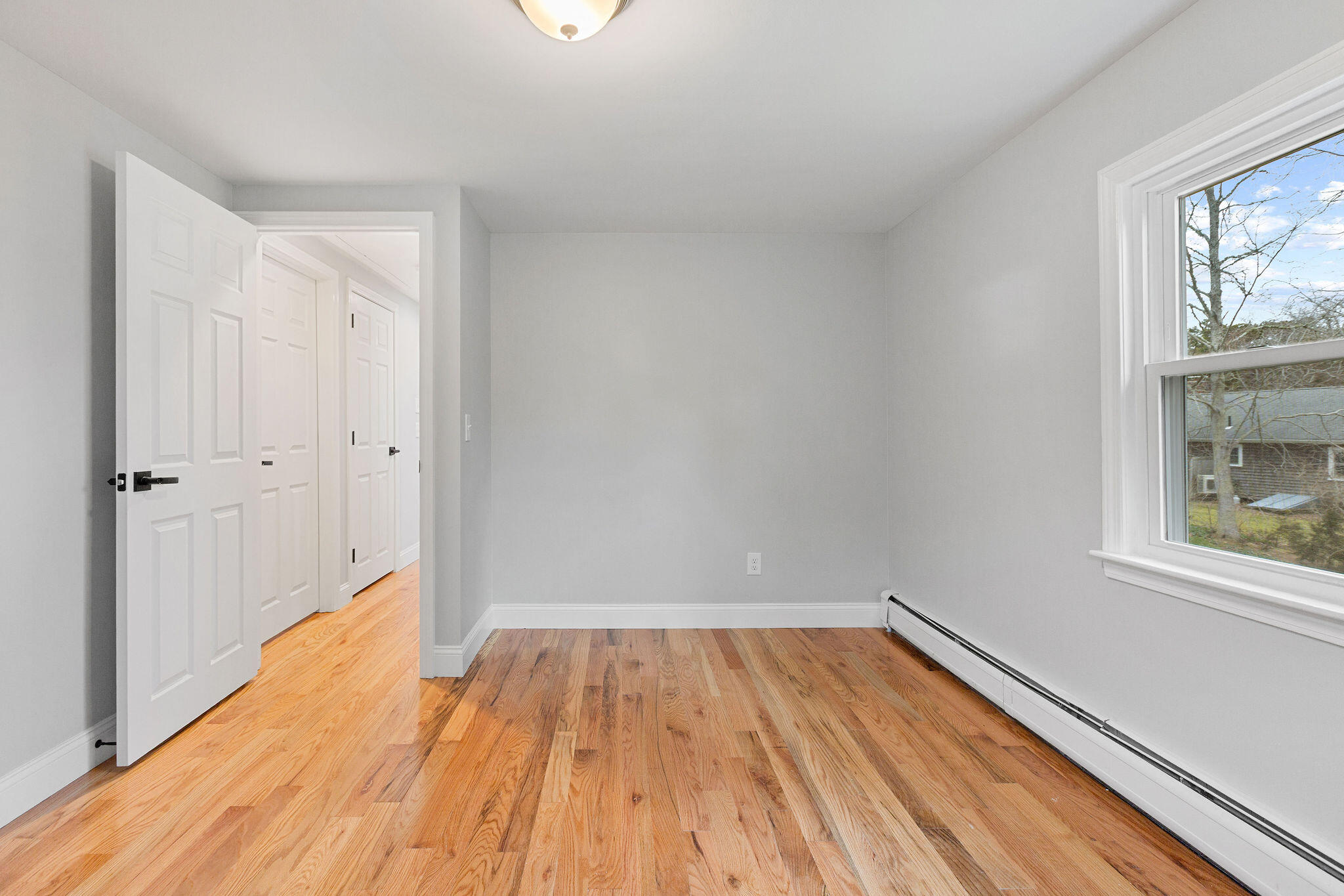 276 Scargo Hill Road South Dennis, MA 02660 - Photo 41 of 53 a view of a room with wooden floor and a window