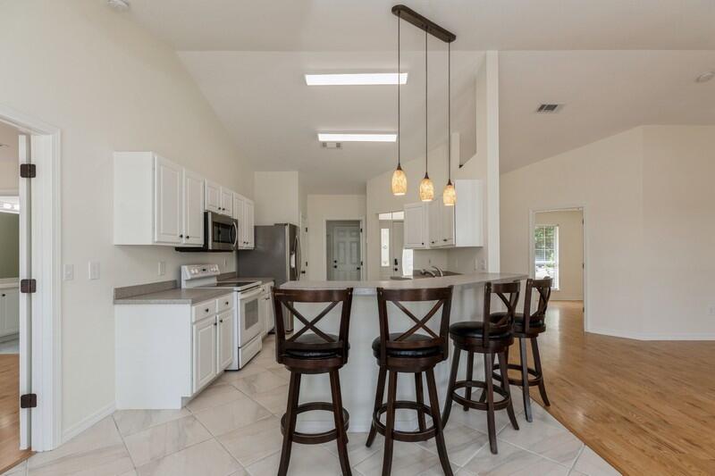 84 Inlet Drive Miramar Beach, FL 32550 - Photo 12 of 38 a large kitchen with a table and chairs