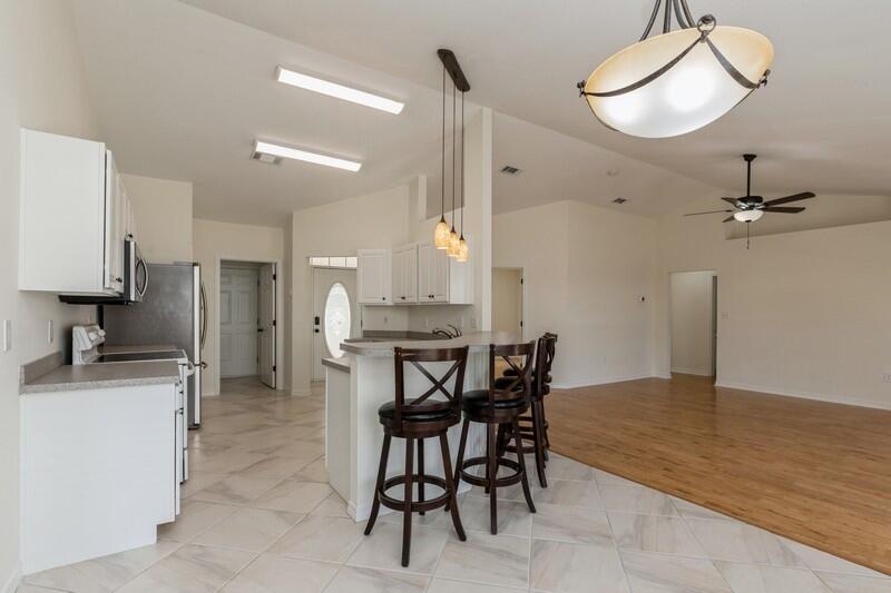 84 Inlet Drive Miramar Beach, FL 32550 - Photo 13 of 38 a view of a dining room with furniture and a chandelier fan