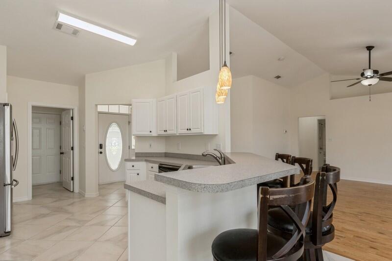 84 Inlet Drive Miramar Beach, FL 32550 - Photo 14 of 38 a kitchen that has a cabinets and a stove in it