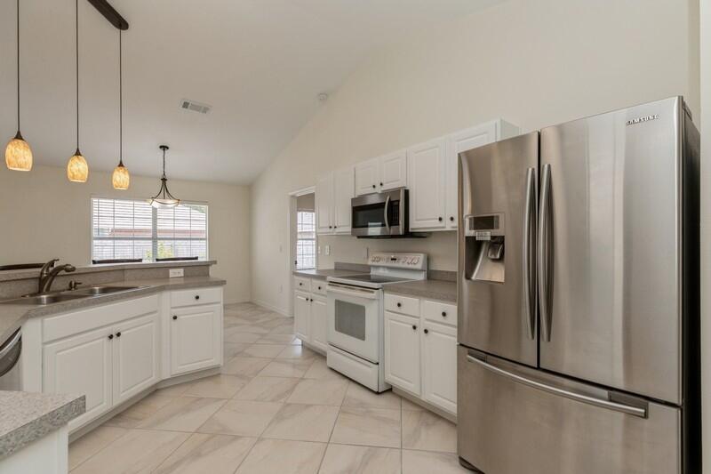 84 Inlet Drive Miramar Beach, FL 32550 - Photo 18 of 38 a kitchen with stainless steel appliances a refrigerator sink and microwave