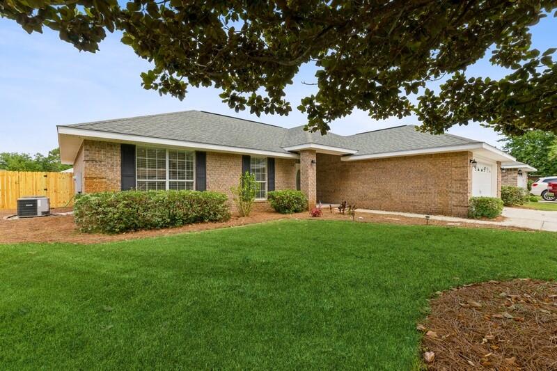 84 Inlet Drive Miramar Beach, FL 32550 - Photo 2 of 38 a front view of a house with a garden