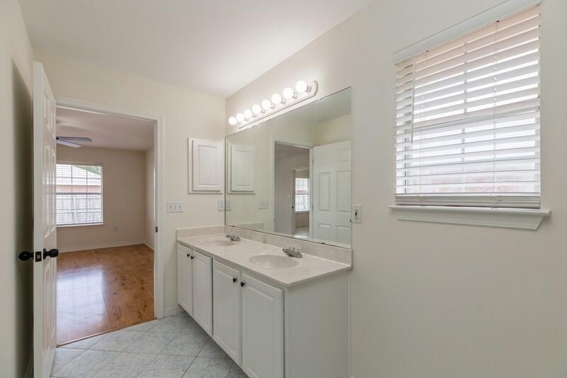 84 Inlet Drive Miramar Beach, FL 32550 - Photo 24 of 38 a bathroom with a sink double vanity and a mirror