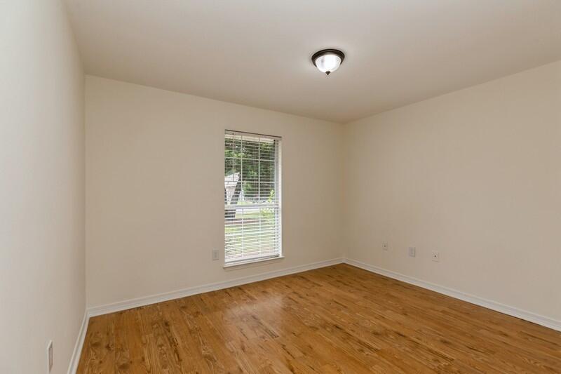 84 Inlet Drive Miramar Beach, FL 32550 - Photo 26 of 38 an empty room with wooden floor and windows