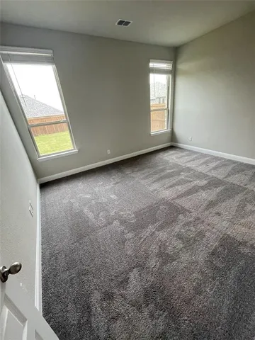 a view of empty room with windows