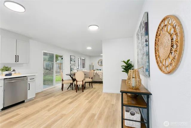 a view of a dining room with furniture window and wooden floor