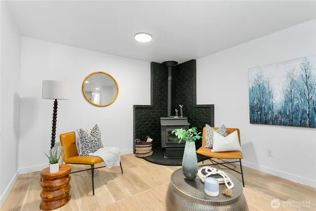 a living room with furniture and a mirror