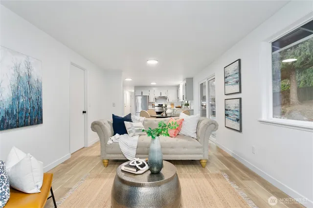 a living room with furniture and a large window