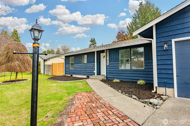 a front view of a house with garden