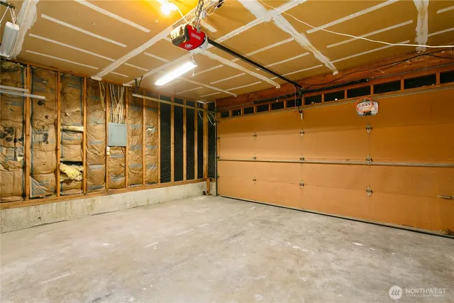 a view of an empty room with wooden walls