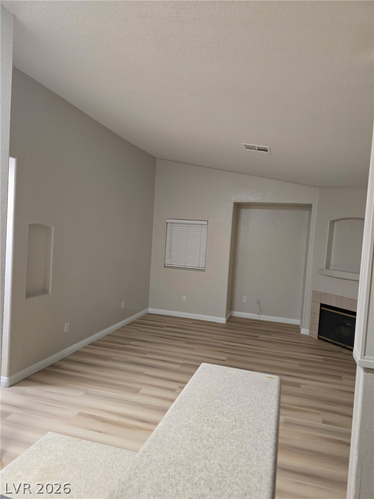 4730 East Craig Road, Unit 2142 Las Vegas, NV 89115 - Photo 3 of 8 This inviting space features durable flooring and a cozy fireplace, perfect for daily living.