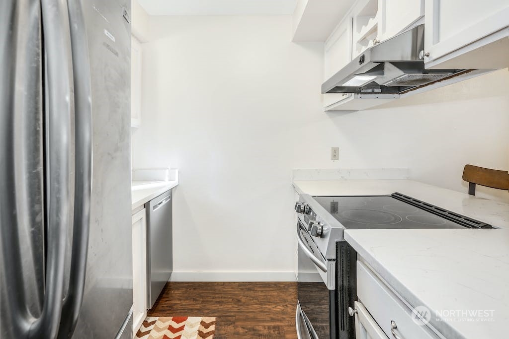 18910 Bothell Everett Highway, Unit D3 Bothell, WA 98012 - Photo 16 of 29 a kitchen with a refrigerator and a sink