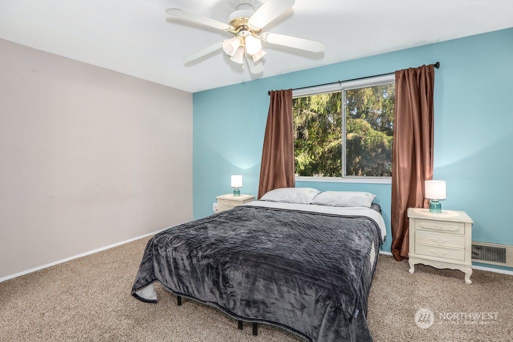 18910 Bothell Everett Highway, Unit D3 Bothell, WA 98012 - Photo 18 of 29 a bedroom with a bed and a window