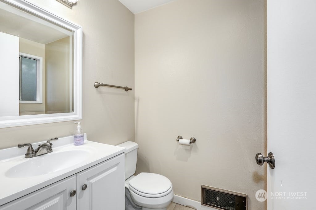 18910 Bothell Everett Highway, Unit D3 Bothell, WA 98012 - Photo 22 of 29 a bathroom with a sink toilet and a mirror