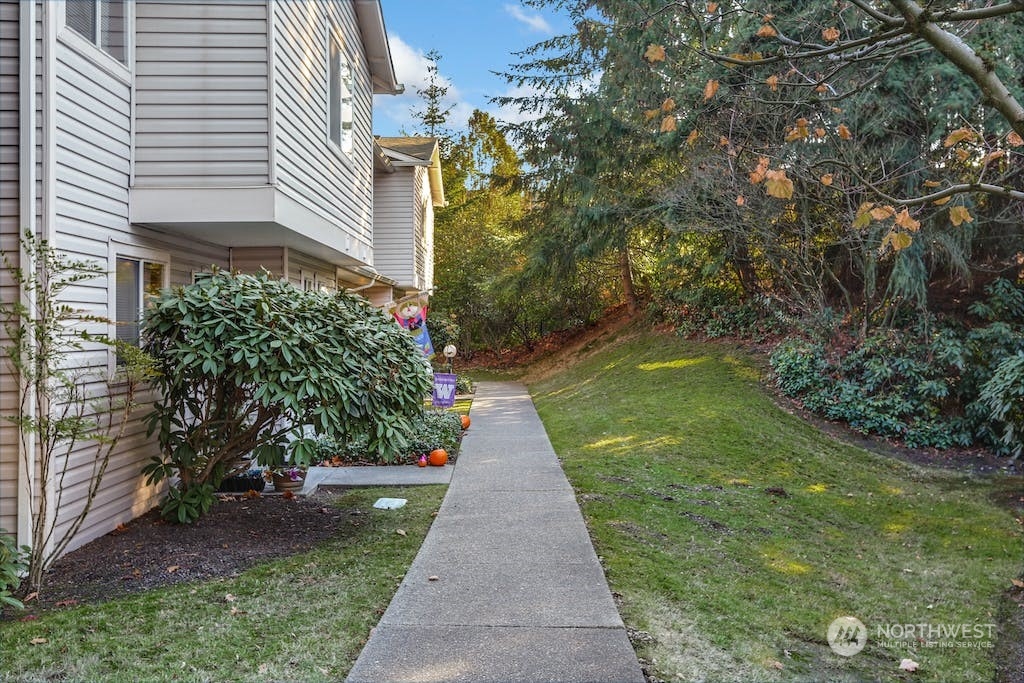 18910 Bothell Everett Highway, Unit D3 Bothell, WA 98012 - Photo 3 of 29 a view of a pathway with house on both side