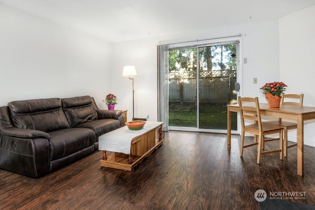 18910 Bothell Everett Highway, Unit D3 Bothell, WA 98012 - Photo 9 of 29 a living room with furniture and a wooden floor