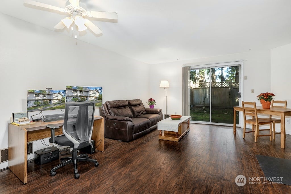 18910 Bothell Everett Highway, Unit D3 Bothell, WA 98012 - Photo 10 of 29 a living room with furniture and a wooden floor