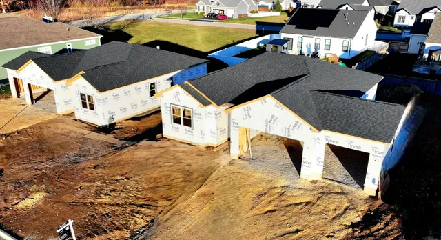 a aerial view of a house with a yard