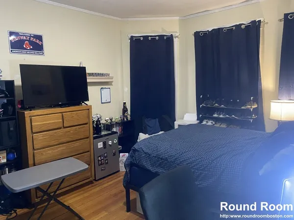 a bedroom with a bed and furniture