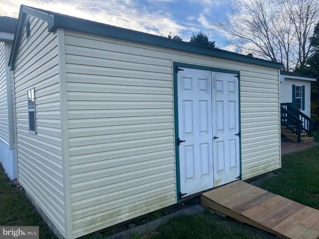a view of backyard with cabin