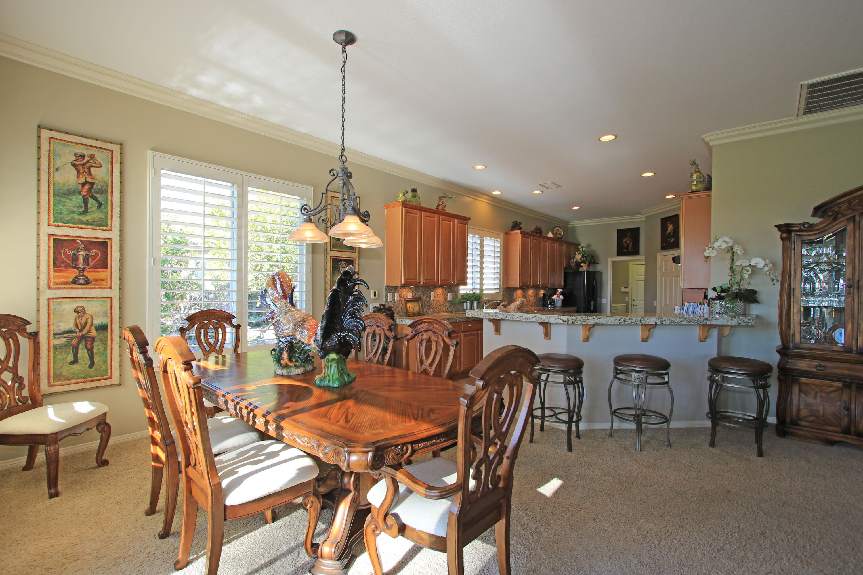 44530 Knightswood Road Indio, CA 92201 - Photo 13 of 38 a view of a dining room with furniture window and outside view