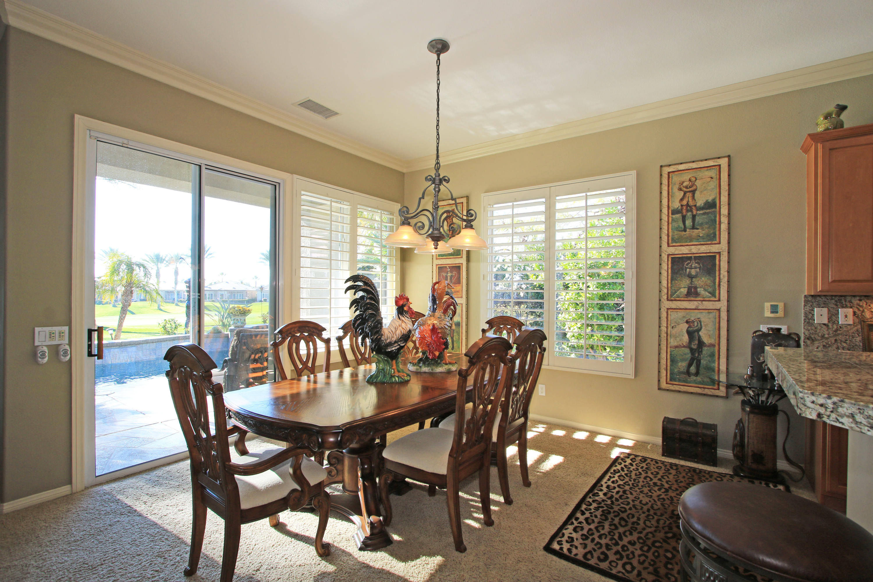 44530 Knightswood Road Indio, CA 92201 - Photo 14 of 38 a view of a dining room with furniture window and outside view