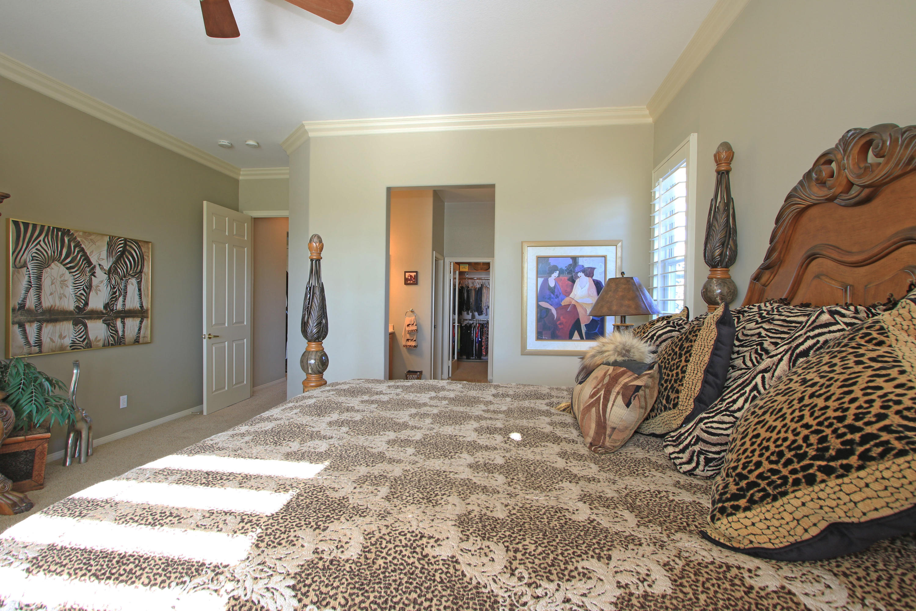 44530 Knightswood Road Indio, CA 92201 - Photo 16 of 38 a bedroom with a bed a couch and dresser