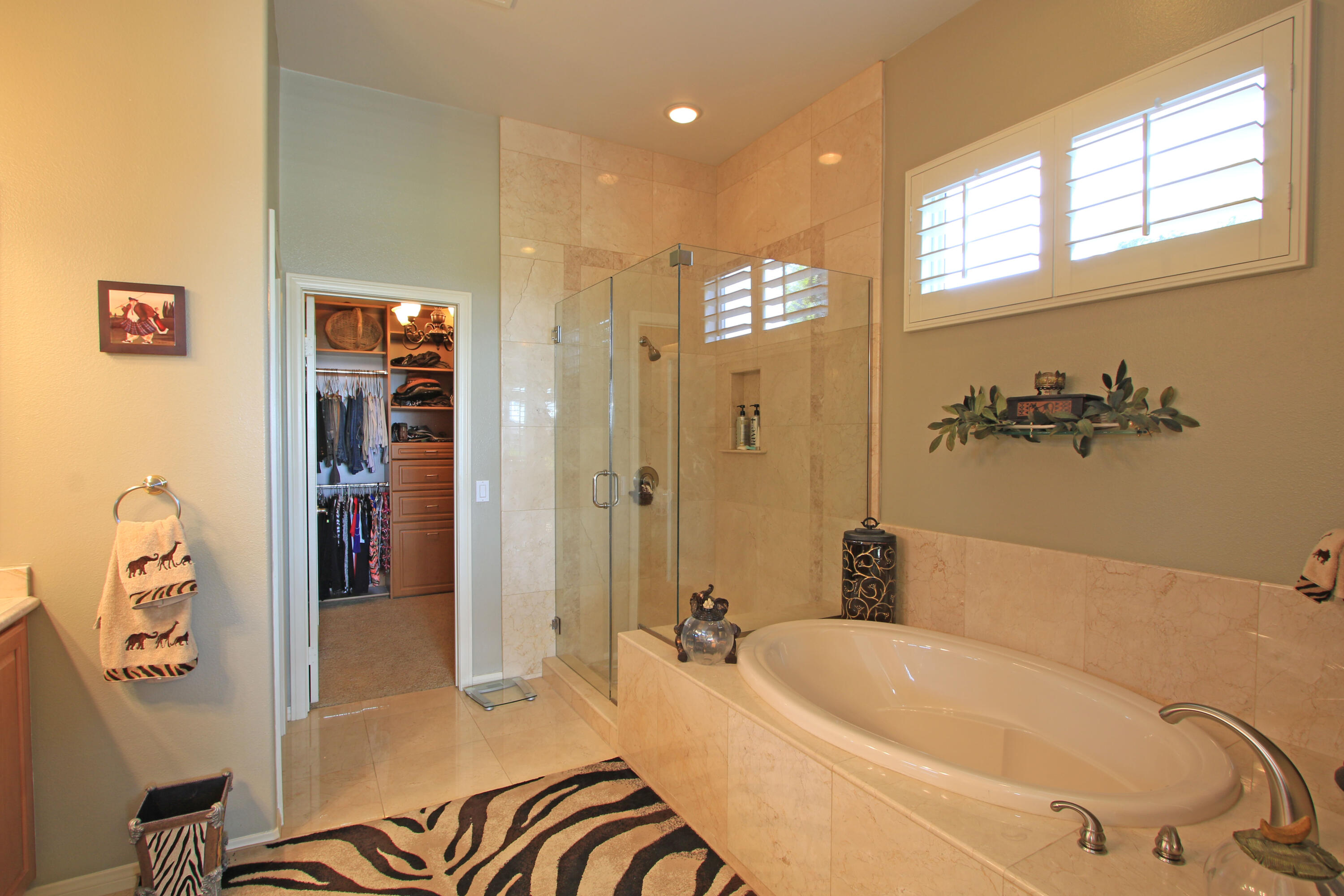44530 Knightswood Road Indio, CA 92201 - Photo 18 of 38 a bathroom with a bathtub and shower