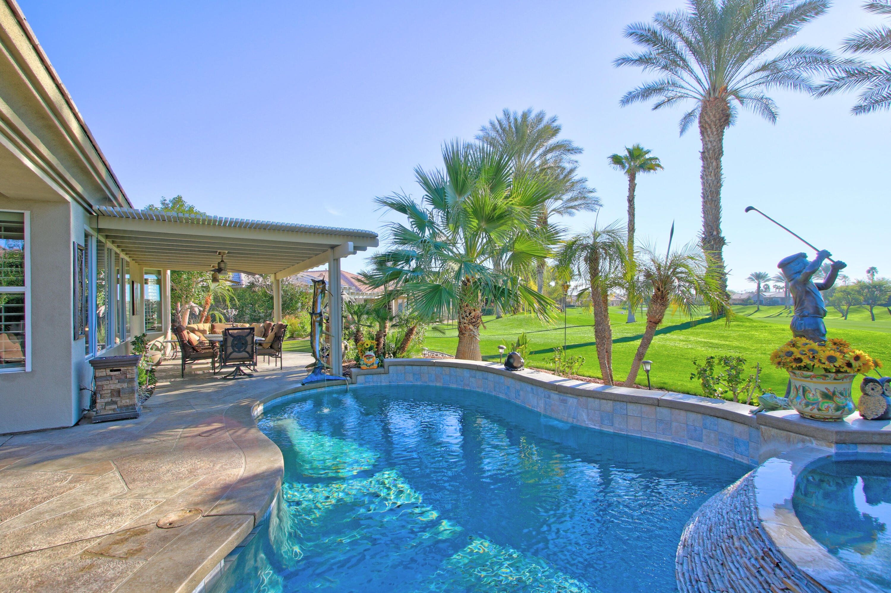 44530 Knightswood Road Indio, CA 92201 - Photo 26 of 38 a view of a backyard with plants and patio