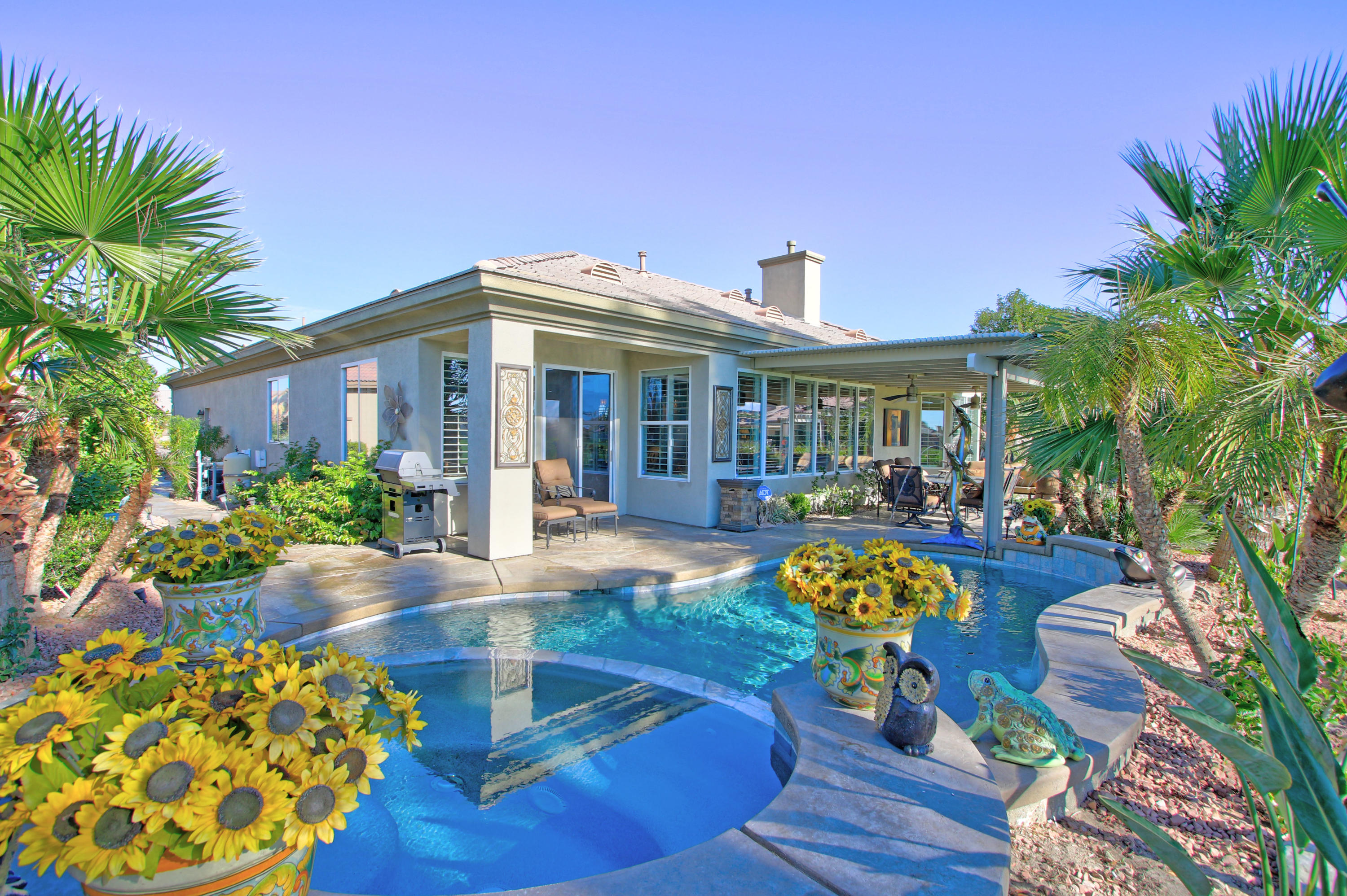 44530 Knightswood Road Indio, CA 92201 - Photo 28 of 38 a view of a house with swimming pool and porch with furniture