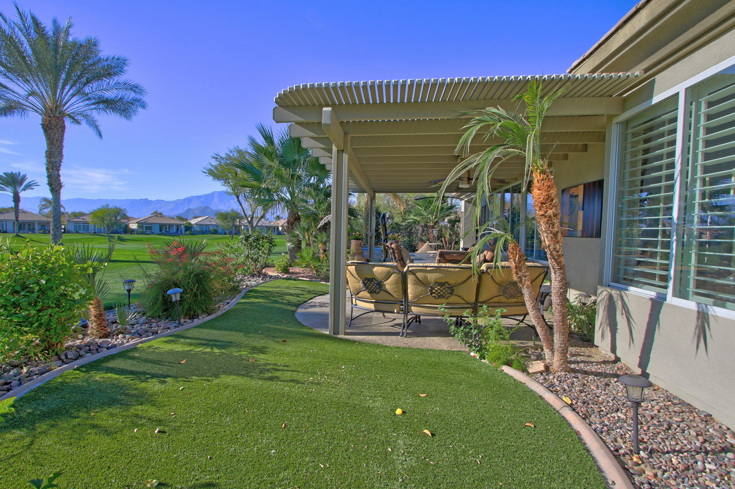 44530 Knightswood Road Indio, CA 92201 - Photo 30 of 38 a view of a house with backyard porch and sitting area
