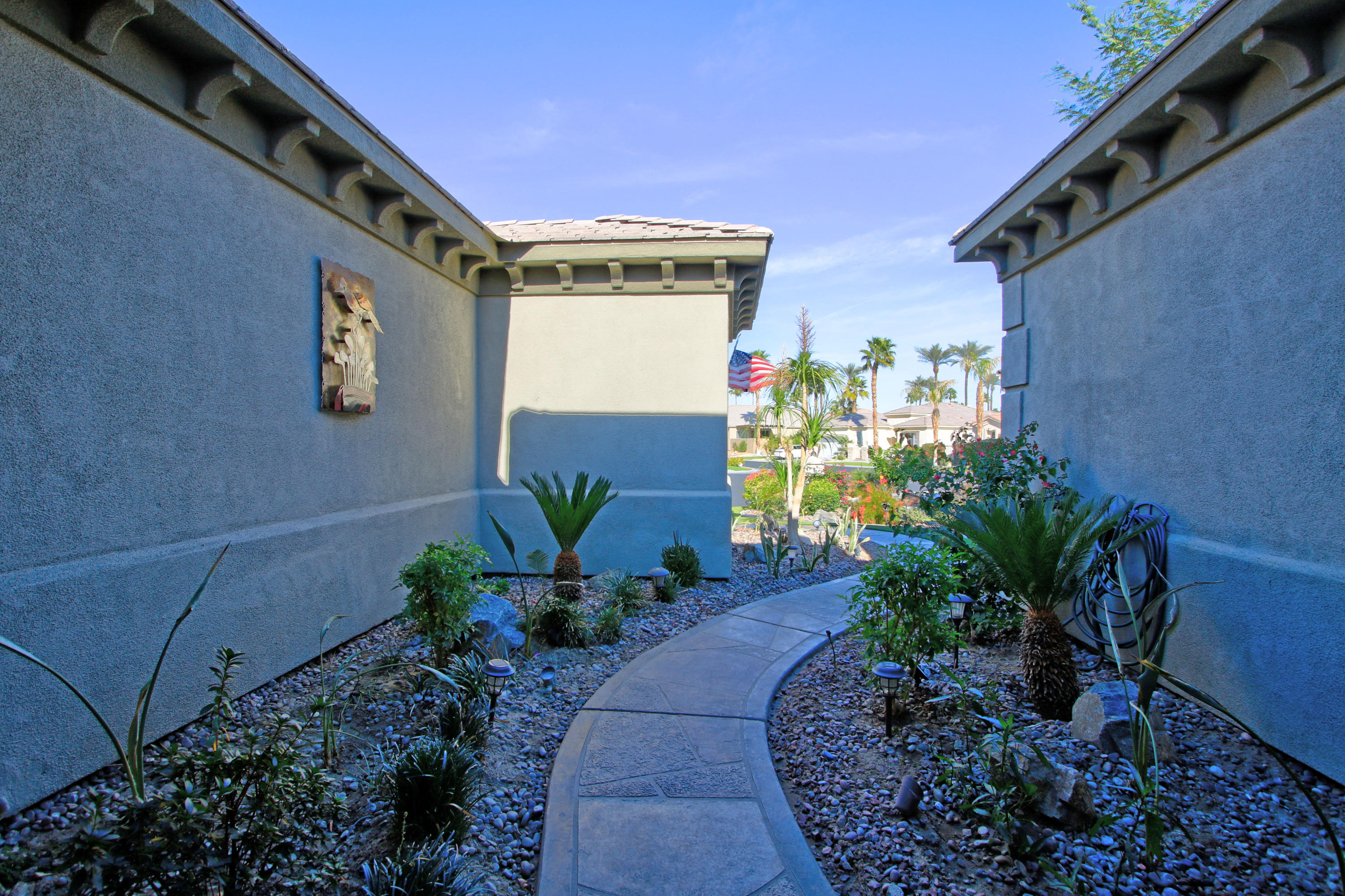 44530 Knightswood Road Indio, CA 92201 - Photo 4 of 38 a house with a flower garden