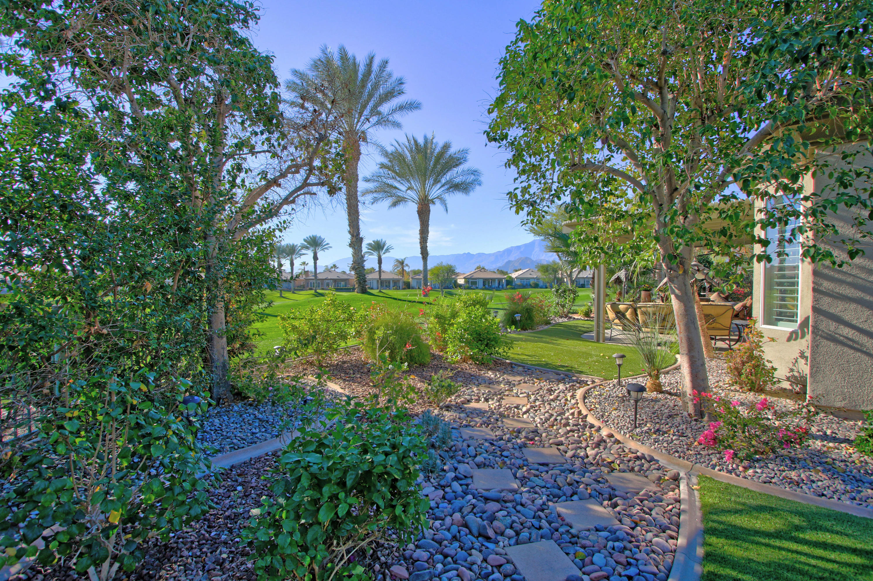 44530 Knightswood Road Indio, CA 92201 - Photo 33 of 38 a view of a garden with a tree