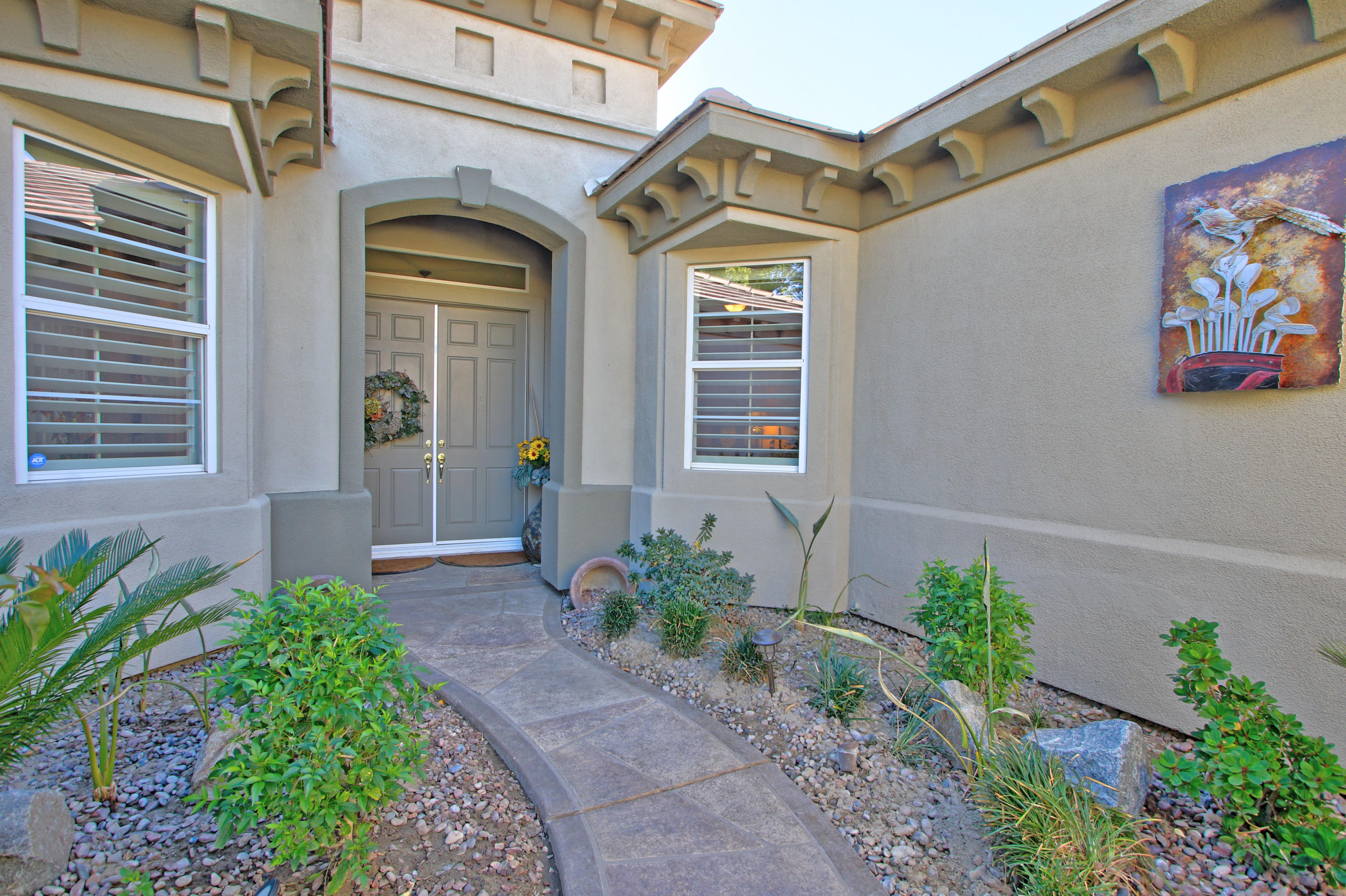 44530 Knightswood Road Indio, CA 92201 - Photo 5 of 38 a front view of a house with a yard