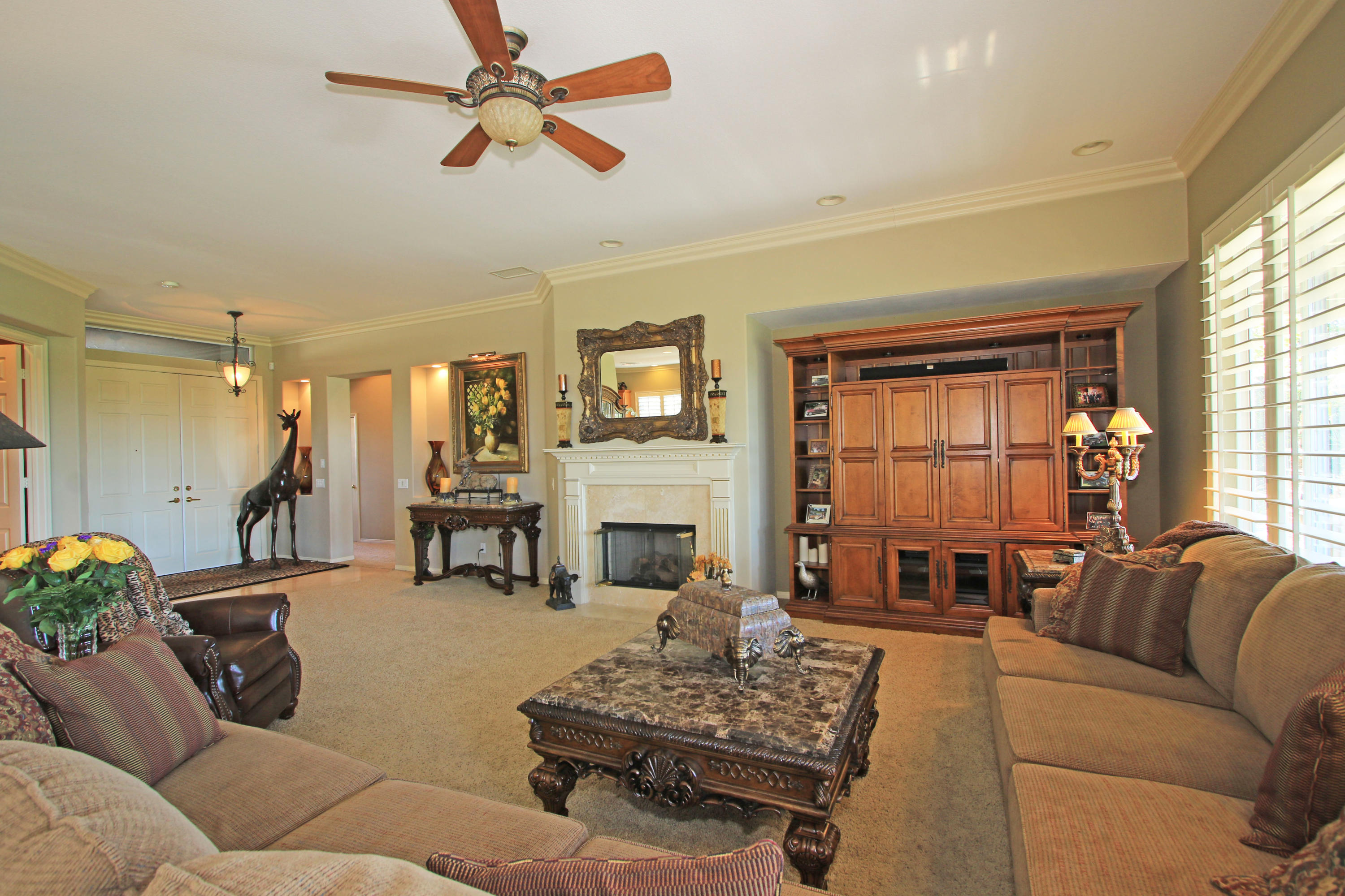 44530 Knightswood Road Indio, CA 92201 - Photo 8 of 38 a living room with furniture and a fireplace