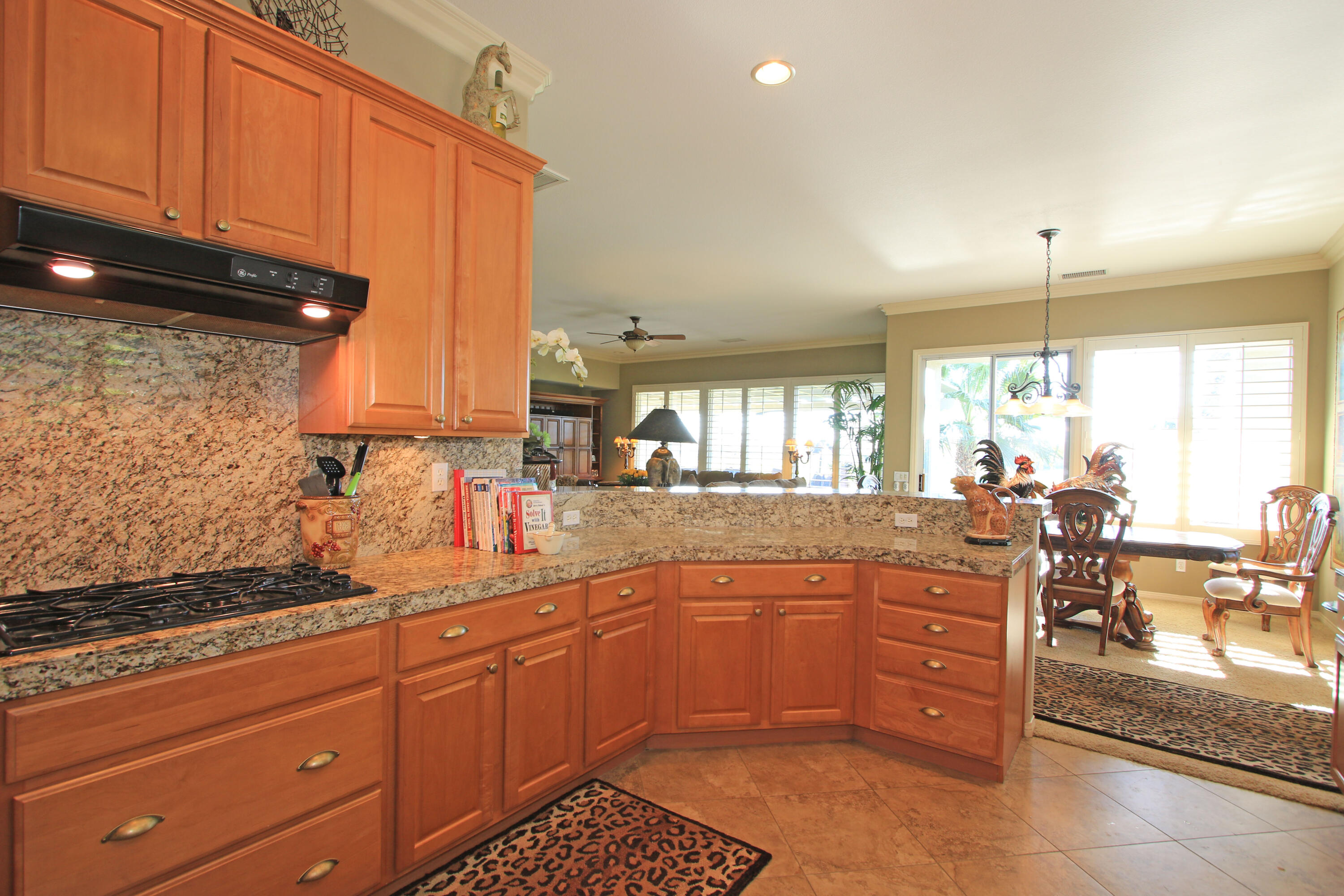 44530 Knightswood Road Indio, CA 92201 - Photo 10 of 38 a kitchen with lots of counter space and windows