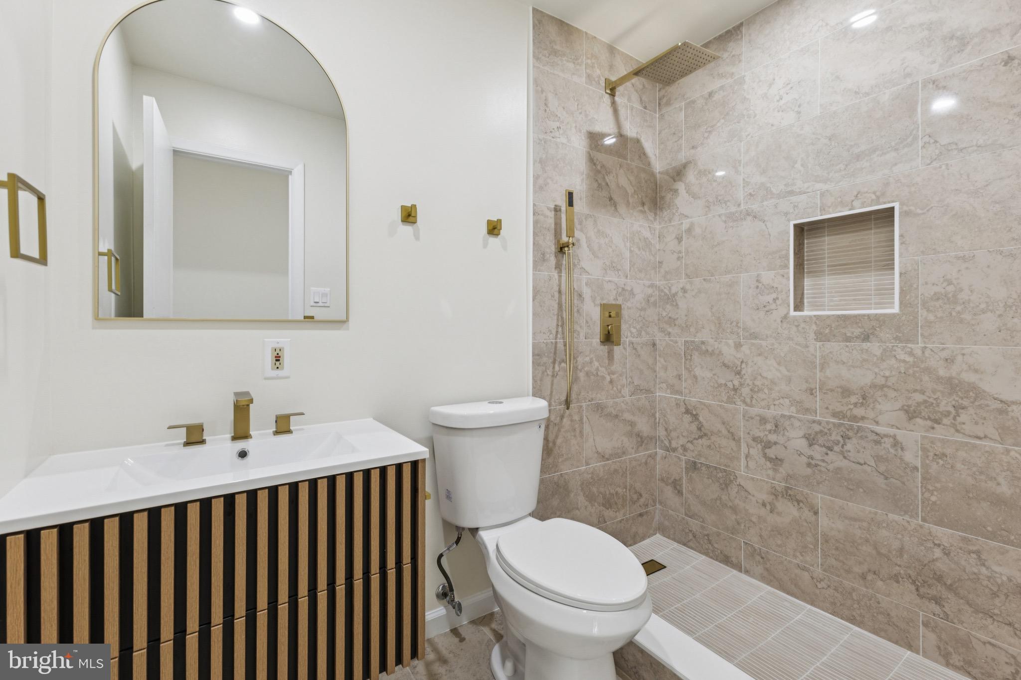 2202 Princess Anne Lane Woodbridge, VA 22191 - Photo 11 of 25 a bathroom with a sink toilet and shower