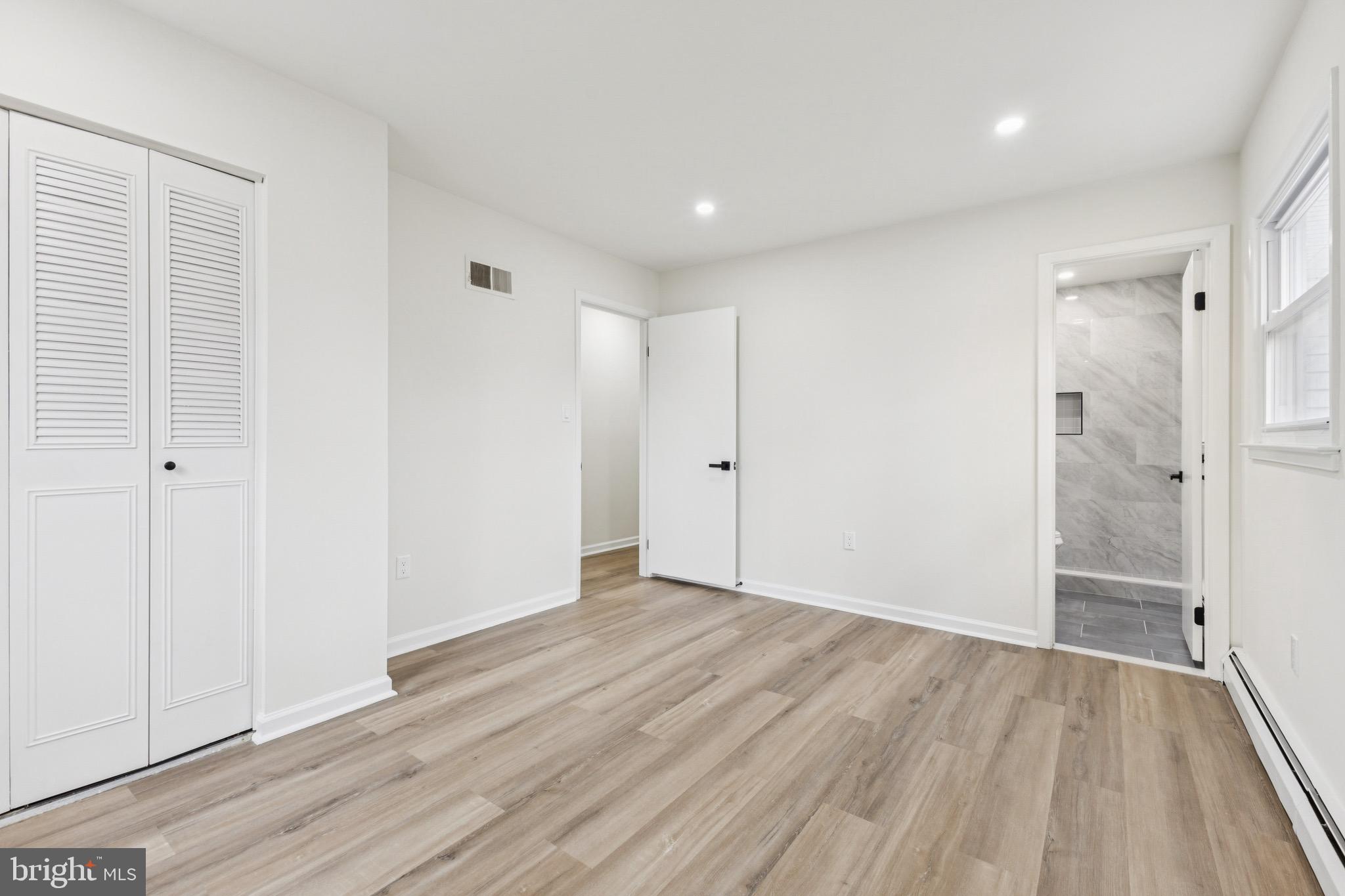 2202 Princess Anne Lane Woodbridge, VA 22191 - Photo 12 of 25 a view of an empty room with wooden floor