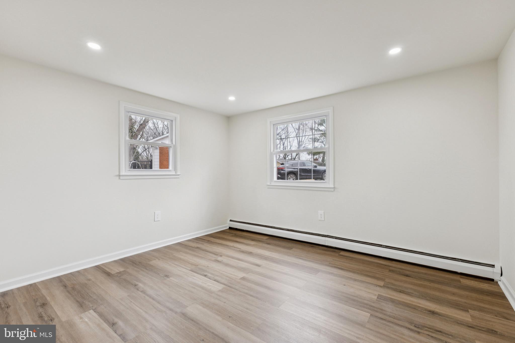 2202 Princess Anne Lane Woodbridge, VA 22191 - Photo 15 of 25 a view of a room with wooden floor and window