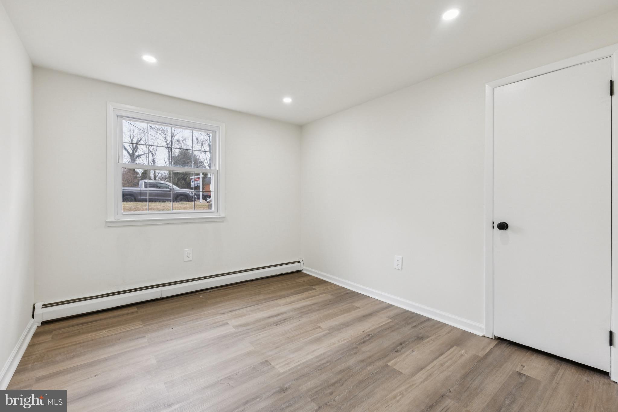 2202 Princess Anne Lane Woodbridge, VA 22191 - Photo 18 of 25 a view of empty room with wooden floor and fan