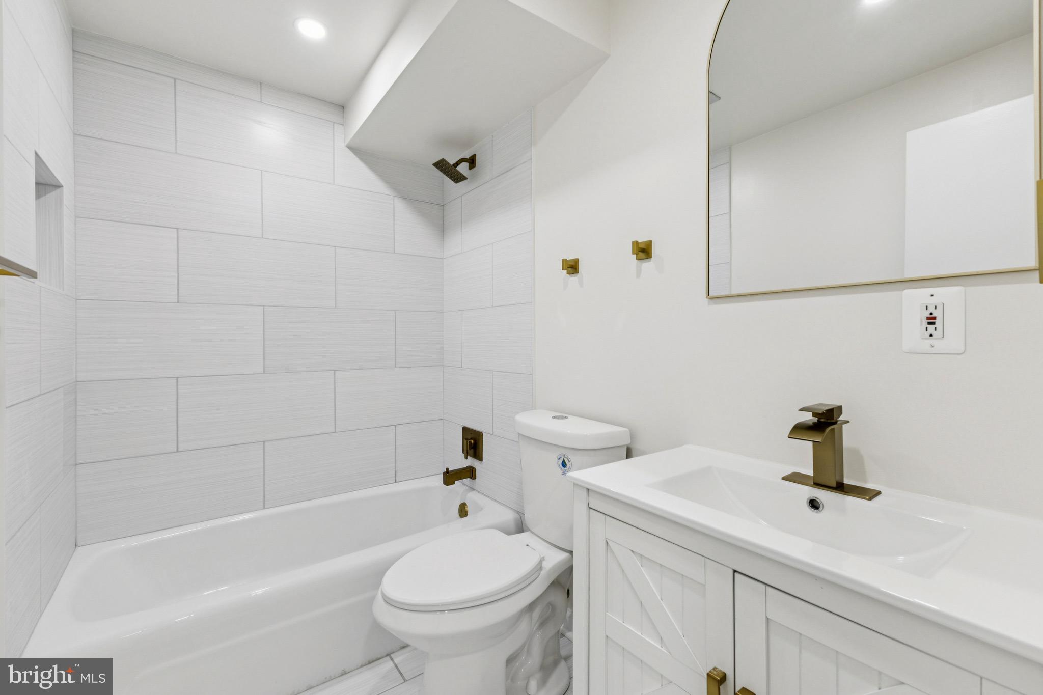 2202 Princess Anne Lane Woodbridge, VA 22191 - Photo 22 of 25 a bathroom with a sink a toilet and bathtub