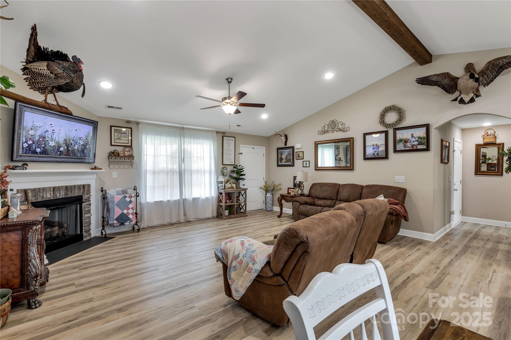 2757 Bobcat Road Heath Springs, SC 29058 - Photo 6 of 35 a living room with furniture and fireplace with wooden floor