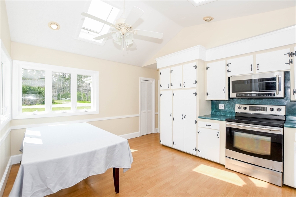 60 Mendell Road Rochester, MA 02770 - Photo 19 of 42 a spacious bedroom with a bed and a fireplace