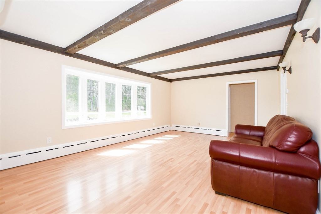 60 Mendell Road Rochester, MA 02770 - Photo 20 of 42 a living room with furniture and a large window
