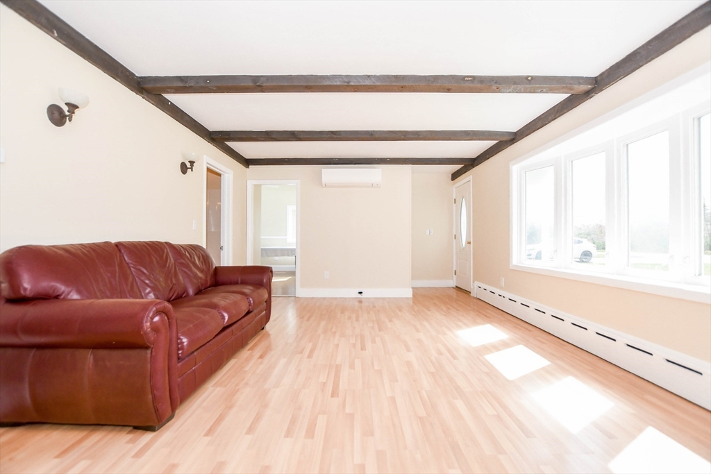 60 Mendell Road Rochester, MA 02770 - Photo 21 of 42 a living room with a couch and a window